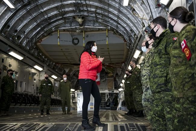 Defence Minister Anita Anand speaks to military personnel after getting a tour of the CC 177 Globemaster aircraft at Canadian Forces Base Trenton, in Trenton, Ont., Thursday, April 14, 2022. THE CANADIAN PRESS/Christopher Katsarov