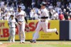New York Yankees' Anthony Rizzo rounds the bases after Rizzo's home run as Cleveland Guardians shortstop Amed Rosario watches during the first inning of a baseball game, Sunday, April 24, 2022 in New York. (AP Photo/Jessie Alcheh)