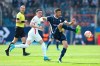 Augsburg's Ruben Vargas, left, and Bochum's Anthony Losilla fight for the ball during a German Bundesliga soccer match between VfL Bochum and FC Augsburg in Bochum, Germany, Sunday, April 24, 2022. (David Inderlied/dpa via AP)