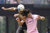 Atlanta United defender Miles Robinson, left, heads the ball against Inter Miami forward Leonardo Campana, Sunday, April 24, 2022, during the second half of an MLS soccer match in Fort Lauderdale, Fla. (AP Photo/Wilfredo Lee)