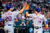 New York Mets' Mark Canha (19) celebrates his run scored against the Arizona Diamondbacks with teammate Pete Alonso (20) during the first inning of a baseball game Sunday, April 24, 2022, in Phoenix. (AP Photo/Ross D. Franklin)