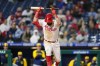 Philadelphia Phillies' Kyle Schwarber reacts after striking out against Milwaukee Brewers pitcher Josh Hader during the ninth inning of a baseball game, Sunday, April 24, 2022, in Philadelphia. (AP Photo/Matt Slocum)