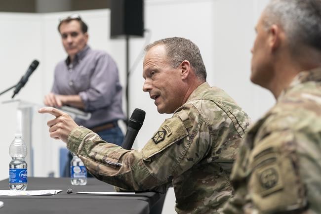 Pentagon spokesman John Kirby, left, U.S. Army Lt. Gen. John Kolasheski, the Commanding General of V Corps, and U.S. Army Maj. Gen. Christopher LaNeve, Commanding General, 82nd Airborne Division, speak with reporters, Sunday, April 24, 2022, in Poland near the Ukraine border. The Biden administration has unveiled new U.S. military assistance and a diplomatic surge for Ukraine as Secretary of State Antony Blinken and Defense Secretary Lloyd Austin made a secrecy-shrouded visit to the capital of Kyiv. (AP Photo/Alex Brandon, Pool)