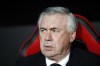 Real Madrid's head coach Carlo Ancelotti looks out from the bench before a Spanish La Liga soccer match between Sevilla and Real Madrid at the Ramon Sanchez Pizjuan stadium, in Seville, Spain, Sunday, April 17, 2022. (AP Photo/Angel Fernandez)