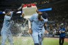 Toronto Blue Jays left fielder Lourdes Gurriel Jr. (13) and first baseman Vladimir Guerrero Jr. (27) celebrate by pouring cooler water on shortstop Bo Bichette (11) after the Toronto Blue Jays defeated the Boston Red Sox 6-2 in nine innings MLB baseball action against, in Toronto, Monday, April 25, 2022. THE CANADIAN PRESS/Christopher Katsarov