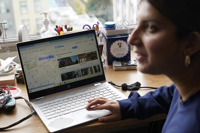 University of California, Berkeley freshman Sanaa Sodhi talks with a friend in her on-campus dorm room while searching online for apartments in Berkeley, Calif., Tuesday, March 29, 2022. Millions of college students in the U.S. are trying to find an affordable place to live as rents surge nationally, affecting seniors, young families and students alike. Sodhi is looking for an apartment to rent with three friends next fall, away from the dorms but still close to classes and activities on campus. They've budgeted at least $5,200 for a two-bedroom. (AP Photo/Eric Risberg)
