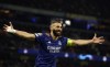 Real Madrid's Karim Benzema celebrates after scoring his side's third goal from penalty during the Champions League semi final, first leg soccer match between Manchester City and Real Madrid at the Etihad stadium in Manchester, England, Tuesday, April 26, 2022. (AP Photo/Dave Thompson)