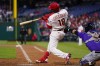 Philadelphia Phillies' Didi Gregorius hits a run-scoring single against Colorado Rockies starting pitcher German Marquez during the second inning of a baseball game, Tuesday, April 26, 2022, in Philadelphia. (AP Photo/Matt Slocum)