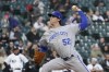 Kansas City Royals starting pitcher Daniel Lynch delivers during the first inning of the team's baseball game against the Chicago White Sox on Tuesday, April 26, 2022, in Chicago. (AP Photo/Charles Rex Arbogast)