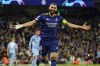 Real Madrid's Karim Benzema celebrates after scoring his side's third goal from penalty during the Champions League semi final, first leg soccer match between Manchester City and Real Madrid at the Etihad stadium in Manchester, England, Tuesday, April 26, 2022. (AP Photo/Dave Thompson)