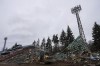A bulldozer works at a central stadium damaged by Russian forces' shelling in Chernihiv, Ukraine, Wednesday, April 13, 2022. (AP Photo/Evgeniy Maloletka)
