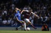 Chelsea's Thiago Silva, left, has his shirt pulled by West Ham's Mark Noble during the English Premier League soccer match between Chelsea and West Ham United at Stamford Bridge in London, Sunday, April 24, 2022. (AP Photo/Alastair Grant)