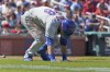 New York Mets' J.D. Davis doubles over after being hit by a pitch during the eighth inning of a baseball game against the St. Louis Cardinals Wednesday, April 27, 2022, in St. Louis. Davis left the game. (AP Photo/Jeff Roberson)