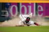 Atlanta Braves left fielder Marcell Ozuna (20) makes a diving attempt for a double by Chicago Cubs' Rafael Ortega during the third inning of a baseball game Wednesday, April 27, 2022, in Atlanta. (AP Photo/John Bazemore)