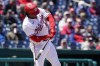 Washington Nationals' Josh Bell hits an RBI-double during the first inning of a baseball game against the Miami Marlins at Nationals Park, Thursday, April 28, 2022, in Washington. (AP Photo/Alex Brandon)