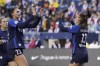 San Diego Wave forward Alex Morgan (13) is greeted by midfielder Taylor Kornieck (22) after Morgan scored a goal against the OL Reign during the first half of an NWSL soccer match, Thursday, April 14, 2022, in Seattle. (AP Photo/Ted S. Warren)