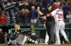 Miami Marlins catcher Jacob Stallings, left, and Washington Nationals' Yadiel Hernandez react as umpire Bill Welke calls Hernandez out at home plate on Maikel Franco's single in the fourth inning of a baseball game, Tuesday, April 26, 2022, in Washington. (AP Photo/Patrick Semansky)