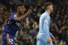 Real Madrid's Vinicius Junior, left, celebrates after scoring his side's second goal during the Champions League semi final, first leg soccer match between Manchester City and Real Madrid at the Etihad stadium in Manchester, England, Tuesday, April 26, 2022. (AP Photo/Dave Thompson)