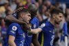 Chelsea's Christian Pulisic, left, celebrates with teammates after scoring the only goal of the game during the English Premier League soccer match between Chelsea and West Ham United at Stamford Bridge in London, Sunday, April 24, 2022. Chelsea won the match 1-0. (AP Photo/Alastair Grant)