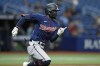 Minnesota Twins' Nick Gordon heads for first base after hitting a double off Tampa Bay Rays relief pitcher Phoenix Sanders during the ninth inning of a baseball game Friday, April 29, 2022, in St. Petersburg, Fla. (AP Photo/Chris O'Meara)