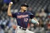 Minnesota Twins starting pitcher Chris Archer throws during the first inning of a baseball game against the Kansas City Royals Tuesday, April 19, 2022, in Kansas City, Mo. (AP Photo/Charlie Riedel)