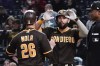 San Diego Padres' Austin Nola (26) and Eric Hosmer celebrate after scoring on a Trayce Thompson hit to left field during the sixth inning of a baseball game against the Pittsburgh Pirates, Friday, April 29, 2022, in Pittsburgh. (AP Photo/Keith Srakocic)