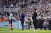 Liverpool's manager Jurgen Klopp, right, and Newcastle's head coach Eddie Howe, center, watch during the English Premier League soccer match between Newcastle United and Liverpool at St. James' Park stadium in Newcastle, England, Saturday, April 30, 2022. (AP Photo/Jon Super)