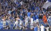 Bochum's players celebrate with their supporters after winning the German Bundesliga soccer match between Borussia Dortmund and VfL Bochum in Dortmund, Germany, Saturday, April 30, 2022. (AP Photo/Martin Meissner)