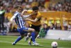 Wolverhampton Wanderers' Rayan Ait-Nouri, right, and Brighton and Hove Albion's Solly March battle for the ball during the English Premier League soccer match at Molineux Stadium, Wolverhampton, England, Saturday April 30, 2022. (Zac Goodwin/PA via AP)