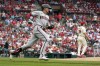 Arizona Diamondbacks' Nick Ahmed, left, rounds the bases after hitting a solo home run off St. Louis Cardinals starting pitcher Miles Mikolas (39) during the eighth inning of a baseball game Saturday, April 30, 2022, in St. Louis. (AP Photo/Jeff Roberson)