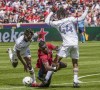 Real Salt Lake forward Sergio Córdova, center, falls between Los Angeles Galaxy forwards Kevin Cabral (9) and Raheem Edwards (44) during an MLS soccer match in Sandy, Utah, Saturday, April 30, 2022. (Leah Hogsten/The Salt Lake Tribune via AP)