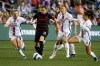 FILE -- Portland Thorns forward Christine Sinclair draws a crowd of OL Reign defenders, from left, forward Veronica Latsko, midfielder Quinn and midfielder Angelina, during the second half of an NWSL Challenge Cup soccer match Friday, March 18, 2022 in Seattle. THE CANADIAN PRESS/The Seattle Times-Jennifer Buchanan&nbsp;via AP