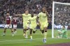 Arsenal's Gabriel, right celebrates after scoring his sides second goal of the game during the English Premier League soccer match between West Ham United and Arsenal at the London stadium in London, Sunday, May 1, 2022. (AP Photo/Ian Walton)
