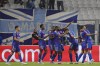 Lyon's Karl Toko Ekambi, center, celebrates after scoring his side's third goal during the French League One soccer match between Marseille and Lyon in Marseille, France, Sunday, May 1, 2022. (AP Photo/Daniel Cole)