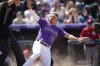Colorado Rockies' Yonathan Daza reacts after scoring on a double by Brendan Rodgers in the second inning of a baseball game against the Cincinnati Reds, Sunday, May 1, 2022, in Denver. (AP Photo/David Zalubowski)