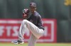 Cleveland Guardians starting pitcher Triston McKenzie winds up to throw against the Oakland Athletics during the first inning of a baseball game in Oakland, Calif., Sunday, May 1, 2022. (AP Photo/Darren Yamashita)