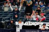 Fans cheer for New York Yankees' Anthony Rizzo as he comes out for a curtain call after hitting his third home run of a baseball game against the Baltimore Orioles, Tuesday, April 26, 2022, in New York. The Yankees won 12-8. (AP Photo/Frank Franklin II)