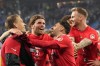 Freiburg players celebrate their win against Hamburg after the end of the German Cup, semifinal soccer match between Hamburger SV and SC Freiburg in Hamburg, Germany, Tuesday, April 19, 2022. Freiburg beet the Hamburg 3-1. (AP Photo/Martin Meissner)