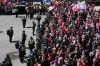 Police hold the line as protesters gather during a demonstration, part of a convoy-style protest participants are calling 