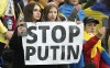 Supporters from Ukraine hold a banner reading 