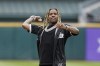 Chicago rapper Lil Durk throws out a ceremonial first pitch before a baseball game between the Chicago White Sox and the Los Angeles Angels, Monday, May 2, 2022, in Chicago. (AP Photo/Charles Rex Arbogast)
