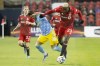 Philadelphia Union's Julián Carranza (centre) is moved off the ball by Toronto FC defender Chris Mavinga (right) during first half MLS action in Toronto on Saturday April 16, 2022. Toronto will be without key defenders Carlos Salcedo and Mavinga on Wednesday when it visits FC Cincinnati on Wednesday in MLS play. nbsp;THE CANADIAN PRESS/Chris Young