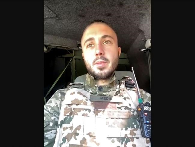 This image taken from video shows Antytila frontman Taras Topolia in uniform during an interview while on patrol in the Ukraine on Tuesday, May 3, 2022. Antytila is collaborating with Ed Sheeran on a reworked version of Sheeran’s hit single “2step.