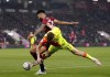 Bournemouth's Philip Billing , left,and Nottingham Forest's Ryan Yates battle for the ball during a Sky Bet Championship soccer match at the Vitality Stadium in Bournemouth, England, Tuesday, May 3, 2022. (John Walton/PA via AP)