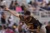 San Diego Padres starting pitcher Mike Clevinger throws against the San Francisco Giants during the second inning of a spring training baseball game, Tuesday, March 29, 2022, in Scottsdale, Ariz. Clevinger's long wait will last one more day. The right-hander's first start for San Diego since undergoing elbow surgery in 2020 was postponed Tuesday, May 3, 2022, as rain and a soggy forecast pushed back the Padres' scheduled game against the Cleveland Guardians. (AP Photo/Matt York, File)