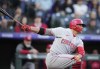 Cincinnati Reds' Joey Votto strikes out against Colorado Rockies starting pitcher Chad Kuhl in the fourth inning of a baseball game Saturday, April 30, 2022, in Denver. (AP Photo/David Zalubowski)
