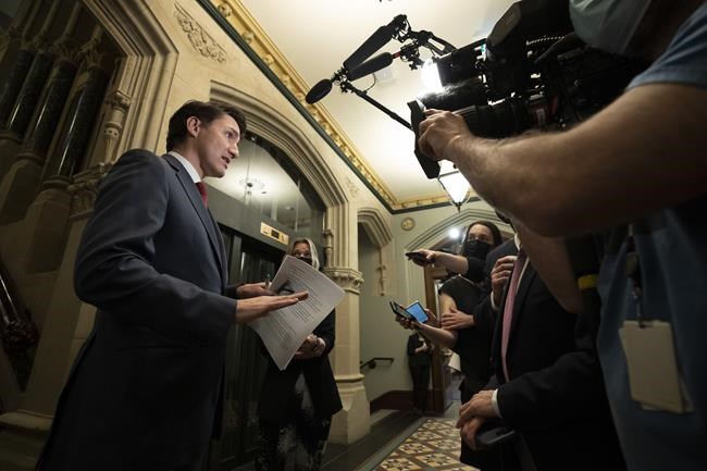 Prime Minister Justin Trudeau speaks with the media as he make his way to caucus on Parliament Hill, Wednesday, May 4, 2022 in Ottawa.Prime Minister Justin Trudeau says his government is looking at using legislation to ensure a woman's right to a safe and legal abortion will be permanently protected in Canada. THE CANADIAN PRESS/Adrian Wyld