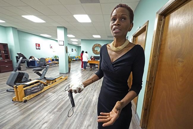 FILE - Getty Israel stands in the Sisters in Birth clinic in Jackson, Miss., on Dec. 17, 2021. Israel, founder of the clinic that serves pregnant women, believes if lawmakers want to prevent abortions, they should eliminate risk factors that lead women to end pregnancies — low-wage jobs and lack of access to healthcare, higher education and transportation. (AP Photo/Rogelio V. Solis, File)
