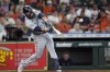 Seattle Mariners' Eugenio Suarez hits a two-run home run against the Houston Astros during the seventh inning of a baseball game Wednesday, May 4, 2022, in Houston. (AP Photo/David J. Phillip)