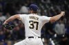 Milwaukee Brewers starting pitcher Adrian Houser throws during the first inning of a baseball game against the Chicago Cubs Friday, April 29, 2022, in Milwaukee. (AP Photo/Morry Gash)